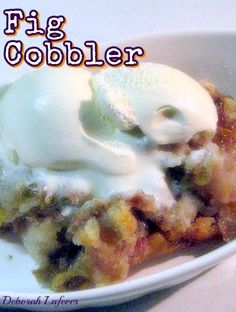 a close up of a plate of food with ice cream on top and the words, fig cobbler above it