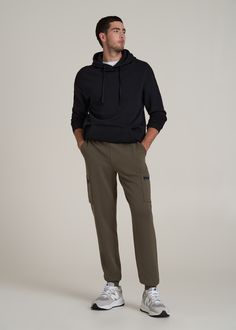 About Our Extra-Long Men's Joggers These tall men's jogger pants have all the comfort of your favorite sweats with the function of a pair of cargo pants. We know how hard it is to find comfy clothes when you're a tall guy, which is why we crafted this pair specifically for your height. The extra-long inseam will end right below the ankle where joggers are supposed to, so you can leave the days of awkward lengths behind. They have a modern fit with cargo pockets on either side featuring zipper cl Tall Men Fashion Casual, Cargo Joggers Mens, Mens Joggers Outfit, Tall Men Fashion, Scrubs Dress, Cargo Outfit, Cozy Sleepwear, Mens Jogger Pants, Tall Men