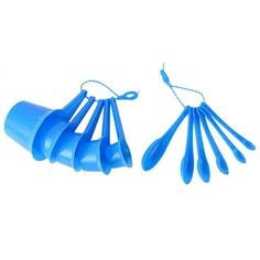 blue plastic utensils are tied together on a white background