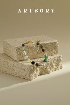 Inspired by mossy forests in the deep mountains, this quartz bracelet transports you to nature's sanctuary. Each translucent quartz bead, reminiscent of glistening dewdrops on moss-covered stones, captures the serene essence of woodland beauty. Wear alone or stack with other gold bracelets for a chic, statement look. In The Deep, Gold Bracelets, Quartz Bracelet, The Deep, Essence, Fan, Bracelet