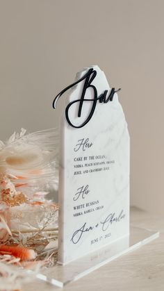 a table sign that says bar on it