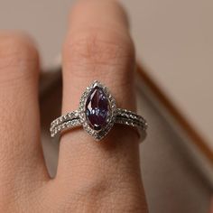 Alexandrite engagement ring marquise cut halo ring June | Etsy Marquise Sapphire Ring With Cubic Zirconia For Promise, Marquise Cut Sapphire Promise Ring, Marquise Cubic Zirconia Halo Ring, 14k White Gold Marquise Rings, Elegant Marquise Birthstone Ring In Sterling Silver, White Gold Marquise Halo Jewelry, Marquise Halo White Gold Jewelry, Marquise Amethyst Anniversary Ring, Marquise Amethyst Ring For Anniversary