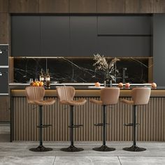 a kitchen with marble counter tops and bar stools