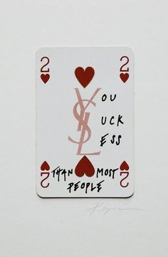 a playing card with the words you luck ess and two hearts on it