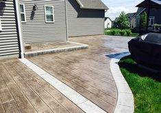 a large wooden deck in front of a house