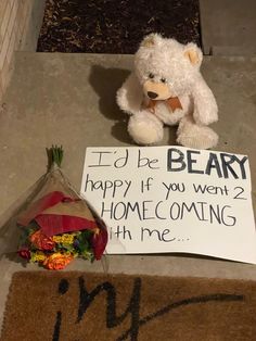 a teddy bear sitting next to a sign that says, i'd be beary happy if you went 2 home coming with me