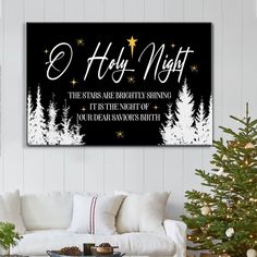 a christmas canvas hanging on the wall above a couch