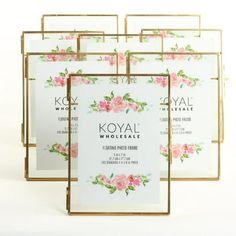 four frames with pink flowers on them and the words koval whole sale written in gold