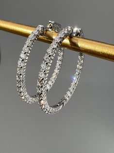 Beautifully crafted in 14 k yellow and white gold, this elegant tennis earrings is adorned with an array of exquisite lab-grown diamonds, offering a refined sparkle that will never go unnoticed. Each stone is carefully selected to perfectly compliment the classic sparkle of the 1.5mm/1.75mm/2mm/ gold hoops, creating a timeless piece, ideal for those with an eye for sophistication and luxury.Tennis earrings featuring brilliant round cut Lab-Grown diamonds totaling 0.78-2.29TCW in 14k Yellow, Whit Timeless Rose Gold Hoop Earrings For Anniversary, 14k White Gold Hoop Earrings For Anniversary, White Gold 14k Hoop Earrings For Anniversary, Diamond White 14k Gold Hoop Earrings, 14k Gold Diamond White Hoop Earrings, 14k Gold White Hoop Earrings, Round White Gold Hoop Earrings With Halo Design, Everyday Luxury Tarnish Resistant White Gold Hoop Earrings, Hypoallergenic Diamond Hoop Earrings In White Gold