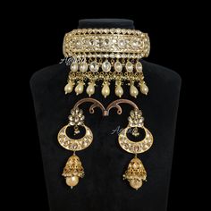 Polki Kundan Necklace inspired by Sabyasachi Iconic designs. This Moissanite Kundan Polki Choker Showcases a fusion of Jadau and Pearls influences, timeless elegance. This Kundan Choker is a masterpieces of any Traditional look. You can pair it with any Black or Red silk saree with Sattle make-up. *𝐏𝐑𝐎𝐃𝐔𝐂𝐓 𝐃𝐄𝐓𝐀𝐈𝐋* * Material: Brass * Plating: Gold Plated * Stone: Semi Precious Kundan, Pearl & Polki. *𝐃𝐈𝐌𝐄𝐍𝐒𝐈𝐎𝐍𝐒* * Necklace- Weight: 82 gm,Length:5.5 Inches, Width: 3.2 Inche Luxury Meenakari Jewelry For Wedding, Elegant Hand Set Traditional Wear For Diwali, Elegant Traditional Wear With Intricate Design For Reception, Luxury Kundan Wedding Necklace With Stone Work, Elegant Traditional Wear For Reception With Intricate Design, Luxury Kundan Necklace With Stone Work For Wedding, Luxury Jewelry For Wedding And Diwali, Elegant Ceremonial Jhumkas With Stone Work, Luxury Stone Work Bridal Necklace For Reception