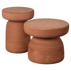 two clay stools sitting next to each other