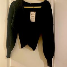 Nwt Black Stretchy Knit Sweater From Zara. Criss Crosses In The Front, Cropped A Little In Front, So Tummy Will Peak Through Unless Wearing A Camisole. Long Sleeves, Perfect With Jeans & Boots For Date Night ! Black Ribbed Long Sleeve Cropped Sweater, Black Ribbed Crew Neck Cardigan, Black Ribbed Crew Neck Cropped Sweater, Black Textured Knit Cropped Sweater For Fall, Fitted Black Cable Knit Sweater, Trendy Black Knitted Cropped Sweater, Trendy Black Textured Knit Cropped Sweater, Black Fitted Textured Knit Cardigan, Fitted Black Textured Knit Cardigan