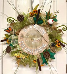 a wreath that says, let the missing fly gone fishing