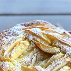 an apple pie with powdered sugar on top