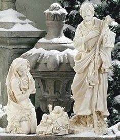 the statues are all white and have snow on their heads, but no one is wearing them