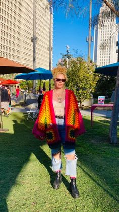 This is gorgeous hand crocheted rainbow open faced cardigan is a must have addition to anyone's wardrobe. It features oversized arms and pockets.  It fits a range from small to x large as it's supposed to fit oversized. Model is a medium. If you need a bigger size or are unsure of your size, message me.  This cardi is not scratchy. It's made from higher end softer yarn. Machine wash, hang dry.  I can make it any color, just let me know! Oversized Rainbow Sweater For Fall, Colorful Oversized Fall Outerwear, Colorful Oversized Outerwear For Fall, Oversized Crochet Outerwear For Fall, Oversized Open Front Cardigan For Festival, Cozy Oversized Outerwear For Festivals, Oversized Multicolor Outerwear For Festival, Oversized Fall Cardigan With Granny Square Details, Multicolor Oversized Open Front Cardigan