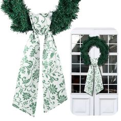 a green and white bow tie next to a window with a wreath on top of it