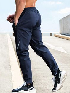 Waist Line:Natural \nFit Type:Regular Fit \nType:Sports Pants \nColor:Blue \nPattern Type:Letter \nLength:Long \nFabric:Slight Stretch \nMaterial:Fabric \nComposition:96% Polyester \nComposition:4% Elastane \nCare Instructions:Machine wash or professional dry clean \nSheer:No \n Men Sport Pants, Sports Pants, Boyfriend Style, Yoga For Men, Winter Sports, Mens Swimwear, Sport Pants, Water Sports, Blue Fabric