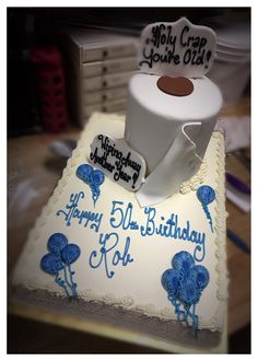 a birthday cake with a coffee mug on top