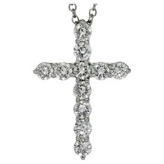 This exquisite authentic Tiffany & Co. necklace features a cross pendant crafted in platinum and set with round brilliant F-G-H VVS1-VVS2 diamonds weighing an estimated 0.40 carats. Made in United States circa 2020s. Measurements: 16.75" (42.5cm) length. Excellent condition. . Platinum Pendant, Tiffany And Co, A Cross, Cross Pendant Necklace, Tiffany & Co., Cross Pendant, Round Brilliant, Jewelry Necklace Pendant, Platinum