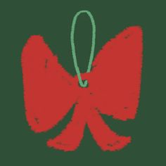 a red bow with a green string hanging from it's end on a black background