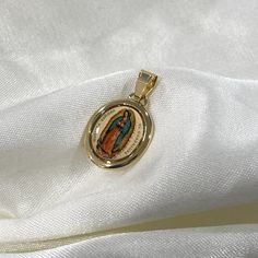 14k Real Yellow Gold Religious Enamel Our Lady of Guadalupe Pendant for Necklace Chain, Virgin Mary Necklace for Women/Men, Everyday Jewelry ✅ PENDANT SPECIFICATIONS:  ➤ Height: 0.71 in. (18 MM)  ➤ Width: 0.59 in. (15 MM)  ➤ Average Weight: 0.98 gr. ✅ PREMIUM 14K GOLD:  Our jewelry is crafted from durable high quality materials, gems, and stones; hand-stamped for authenticity as well as FTC law approved. Unlike cheap costume jewelry, our long lasting jewelry is easy to polish and and won't permanently tarnish or rust! ✅SHIPPING CONTENTS: (*PENDANT ONLY*) ➤14K Gold Pendant. ➤Jewelry Pouch. Gold Our Lady Of Guadalupe Medallion, Yellow Gold Oval Jewelry With Our Lady Of Guadalupe, Oval Yellow Gold Jewelry With Our Lady Of Guadalupe, Our Lady Of Guadalupe Round Pendant As Gift, Mary Necklace, Virgin Mary Necklace, Our Lady Of Guadalupe, Lady Of Guadalupe, Average Weight