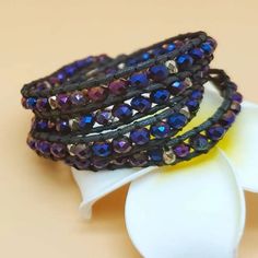 New Beaded Wrap Bracelet Long Single Strand ~ Black Cord ~ Trendy Boho Vibe Intertwined Purple & Blue Oil Slick Holographic Colored Beading Bronze Tone Beaded Accents & Button Style Closure Fantastic Versatile Layered Accessory - Great Jewelry Addition Wear Many Ways Including: As A Necklace / As An Arm Bracelet / Waist-Belly Chain Body Jewelry / Layered Anklet Approx Measurements: 30 In Total 28 Inches Long Beaded Area Closure Points At Last Two Inches Purchasing For Someone? Gift Wrapping Avai Adjustable Hand-wrapped Purple Beaded Bracelet, Purple Beaded Festival Bracelets, Purple Faceted Beads Bracelets For Festivals, Purple Faceted Beads Bracelet For Festivals, Purple Faceted Beaded Bracelets For Festivals, Purple Round Beaded Bracelets For Festivals, Bohemian Wrap Bracelet With Colorful Beads For Party, Hand Wrapped Purple Bracelets, Bohemian Party Wrap Bracelet With Colorful Beads