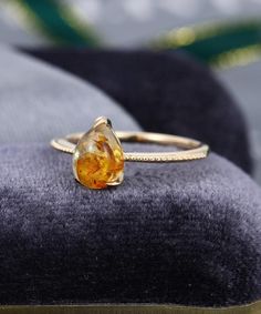 ++++++++++++++Stone SPECIFICATIONS++++++++++++++Amber engagement ringMain Stonecenter stone: 6*8mm pear shaped++++++++++++++Band SPECIFICATIONS++++++++++++++Can be made in 14k or 18k rose gold / white gold / yellow gold.The bandwidth is about 1.5 mm.The band thickness is about 1.2 mm.++++++++++++++ MAKING & SHIPPING TIME++++++++++++++Handmade in my American studio，The making process is about 2-3 weeks.Us domestic shipping time: 3-5 daysInternational shipping time: 5-12 days for most destinat Yellow Gold Teardrop Jewelry For Proposal, Gold Solitaire Ring For Wedding Proposal, Gold Solitaire Ring For Proposal, Teardrop Diamond Cut Ring Gift, Classic 14k Gold Amber Ring, Classic Amber Ring In 14k Gold, Classic Amber 14k Gold Rings, Dainty Teardrop Gold Ring, Gold Solitaire Jewelry For Proposal