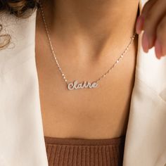 Our Pave Dream Script Name Necklace combines personalized charm with a touch of glamour. Featuring a dainty mirror chain with your chosen name or word in a delicate pavé setting, this elegant necklace is a stunning way to wear a name with pride and style. Wear it alone for a subtle statement or layer it with other necklaces to enhance its glowing effect ♡ SKU: MM-NM160F106 Product Details Material: High Quality Solid 925 Sterling Silver Finish: Sterling Silver ∙ 18K Gold ∙ Rose Gold Dimensions: Trendy Personalized Name Necklace, Personalized Sterling Silver Name Necklace With Adjustable Chain, Adjustable Chain Nameplate Necklace, Elegant Nameplate Charm Necklace, Elegant Personalized Name Charm Necklaces, Trendy Personalized Name Necklace With Adjustable Chain, Elegant Charm Necklaces With Custom Name For Personalized Gift, Custom Name Silver Charm Necklaces, Elegant Personalized Name Charm Necklace