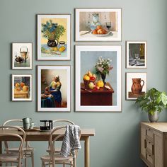 there are pictures on the wall with vases and fruit in them, along with two chairs