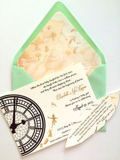 an open envelope with a clock on the front and inside, sitting next to a piece of paper