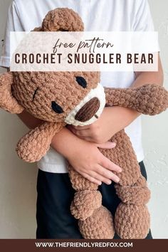 a person holding a teddy bear with the text free pattern crochet snuggler bear