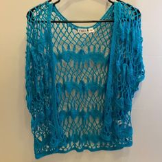 New Top. No Tag. Turquoise Crotchet Jacket Overlay. Measures 25” Chest. 26” King. 100 Acrylic. Fitted Bohemian Blue Cover-up, Spring Casual Crochet Lace Cover-up, Casual Crochet Lace Cover-up For Spring, Blue Summer Crochet Top For Festivals, Blue Bohemian Top With Crochet Trim, Fitted Blue Cover-up For Spring, Blue Casual Crochet Top For Beach, Blue Crochet Lace Top For Vacation, Casual Blue Crochet Top For Beach