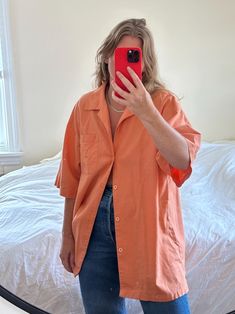 MEASUREMENTS AND ALL AVAILABLE SIZING INFO ARE LISTED FOR EVERY ITEM. Please read this section in detail and reach out with any additional questions :) DESCRIPTION: Vintage oversized light orange linen and cotton button down shirt with short sleeves. Features front chest pocket. The fabric is light to medium weight, has an almost canvas-like texture. Great tucked in or untucked or layered over your favorite tank. Also makes an awesome bathing suit cover up. She is in great condition with no physical marks just light overall fabric fade from prelove wear. Long fit, great for my tall friends!  Tag reads Man of Fashion - size L (mens) - 55% linen 45% cotton Recommended for sizes l-xxxl depending on desired fit. Model is 5' 7 1/2" and a size medium-large. Approximate flat lay measurements are Orange Short Sleeve Shirt For Spring, Orange Button-up Shirt With Pockets, Summer Orange Shirt With Relaxed Fit, Summer Orange Shirt Relaxed Fit, Relaxed Fit Orange Shirt For Summer, Oversized Short Sleeve Shirt With Pockets For Spring, Oversized Short Sleeve Shirt For Summer, Orange Button Down Shirt Outfit, Orange Short Sleeve Tops With Pockets