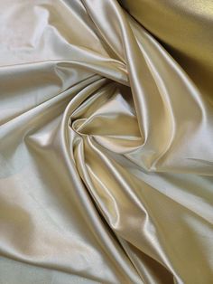 a close up view of a shiny gold fabric