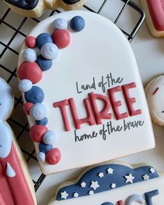 decorated cookies with the words land of the three home of the brave