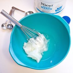 a bowl filled with yogurt next to a whisk