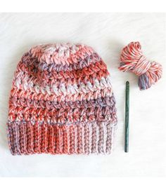 a crocheted hat with yarn next to it