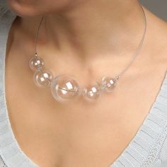 "This Clear glass ball necklace is made of glass in the lampwork technique, each bead is hand blown and unique. This bold chunky necklace is lightweight, stylish and elegant and will become a versatile and irreplaceable addition to your everyday outfits! 💕 You will definitely look stunning in this glass bubble necklace! Dimensions: the necklace length is adjustable, 20\"-22\" inch (51-56cm). Materials: artist lampwork glass beads, metal fittings. 🎁 This large bead necklace will also be a great Handmade Luxury Glass Beaded Necklaces, Clear Glass Beaded Necklaces, Clear Glass Round Bead Necklaces, Clear Glass Necklaces With Round Beads, Clear Glass Round Beads Necklaces, Clear Glass Necklaces For Party, Modern Glass Necklaces With Round Beads, Modern Glass Round Bead Necklaces, Modern Glass Beaded Necklaces