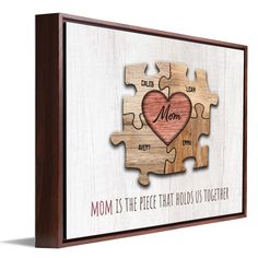 a wooden puzzle with the words mom is the piece that holds us together