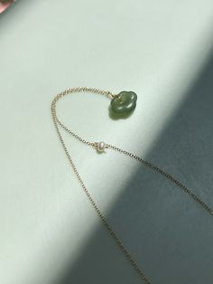 Crafted with a cloud-shaped nephrite jade pendant, this necklace is sure to make a statement. The exquisite detailing and high-quality design make it a distinctive piece you'll treasure for years. Weight: 2g Adjustable chain: gold-plated S925 sterling silver, length 400-430mm Pendant: nephrite, width 15mm x length 12mm x thickness 5mm Jade Pendant Necklace, Cloud Shapes, Nephrite Jade, Jade Necklace, Jade Jewelry, Chain Gold, Green Necklace, Jade Pendant, Green Jade