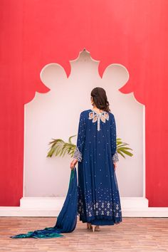 Introducing our Dark Blue Long Shalwar Kameez, featuring exquisite zari, sequins, naqshi, kora, and dabka work on the neckline and sleeves. The cutwork embroidery with crystal drops adds a touch of elegance, while the fabric and silk lining provide comfort. The navy blue chiffon dupatta with a silver sequin chhan and contrasting sea green silk border completes the look. Naqshi Georgette Anarkali Set For Reception, Georgette Anarkali Set With Naqshi For Reception, Naqshi Embroidered Lawn Suit For Reception, Unstitched Naqshi Salwar Kameez For Reception, Eid Reception Dress With Naqshi Detailing, Naqshi Dresses For Eid Reception, Unstitched Salwar Kameez For Reception With Naqshi Detailing, Bollywood Style Lawn Suit With Zari Work For Reception, Reception Anarkali Lawn Suit With Naqshi Detail