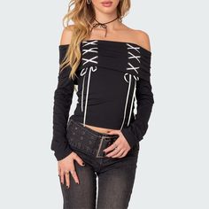 Elevate your style effortlessly with our Black Gothic Off-The-Shoulder Long Sleeve Top. The lace-up detail and folded neckline bring an edgy touch, while the bardot top style exudes sophistication. Crafted from a comfortable and stylish blend of polyester and spandex, this top is a must-have for your wardrobe. Lace-up detail Folded neckline Long sleeves Bardot top style Comfortable blend of polyester & spandex Edgy Off-shoulder Party Tops, Trendy Off-shoulder Top For Night Out In Fall, Gothic Crop Top For Spring Night Out, Gothic Crop Top For Night Out In Spring, Spring Gothic Crop Top For Night Out, Fall Off-shoulder Top For Night Out, Casual Off-shoulder Top For Fall Night Out, Edgy Off-shoulder Top For Fall, Gothic Tops For Night Out In Spring