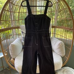 Super Cute Black Wide Leg Jumpsuit, Button Up, Pockets, Can Be Worn As Is Or Layered With A White Baby Tee Black Bib Front Jumpsuit For Work, Black Bib Front Overalls For Workwear, Chic Black Cotton Jumpsuits And Rompers, Black Bib Front Jumpsuit For Spring, Chic Black Overalls For Spring, Black Button-up Jumpsuits And Rompers For Summer, Black Button-up Jumpsuits And Rompers, Black Summer Overalls For Workwear, Chic Cotton Jumpsuits And Rompers With Button Closure