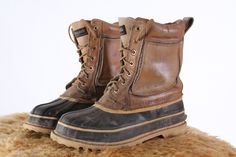 vintage mens hiking boots Tan saddle leather Brown rubber size 8 good vintage condition, already broken in. No rips, or tears. Soles are in good shape. Uncleaned and unrestored condition. Please ask questions before purchasing, all sales are final. Rustic Steel Toe Work Boots For Outdoor, Rustic Outdoor Work Boots With Steel Toe, Rugged Sturdy Boots For Winter, Rugged Sturdy Winter Boots, Sturdy Rugged Winter Boots, Western Style Work Boots For Outdoor Winter, Western Style Work Boots For Winter Outdoor, Western Style Winter Work Boots For Outdoor, Rugged Sturdy Work Boots For Winter