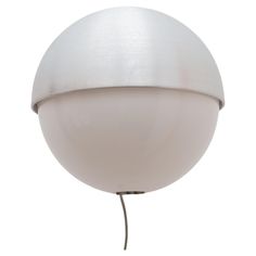 a large white ball light on a metal pole with a wire attached to it's end