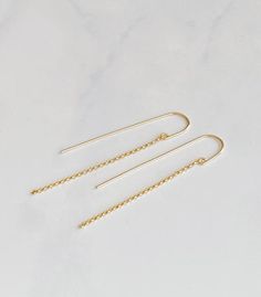 These simple modern threaders are lightweight and make great everyday earrings.  The threader is hand forged from 14kt gold filled wire into a curved U shape. 14kt gold filled rolo chain dangles from the front of the threader.  The drop length of the chain is 2 1/2” Delicate 14k Gold Filled Threader Earrings, 14k Yellow Gold Filled Threader Earrings With Delicate Chain, Delicate 14k Yellow Gold Filled Threader Earrings, Dainty 14k Gold Threader Earrings With Adjustable Chain, Dainty 14k Gold Threader Earrings With Delicate Chain, Minimalist 14k Gold Linear Earrings With Adjustable Chain, Everyday Threader Drop Earrings With Delicate Chain, Everyday Drop Threader Earrings With Delicate Chain, Delicate Chain Drop Threader Earrings For Everyday