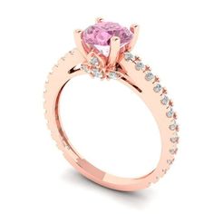 a pink diamond ring with diamonds on the side