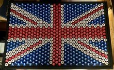 a british flag made out of beer caps