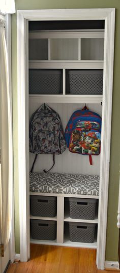 a closet with two backpacks and some baskets on the shelf next to each other